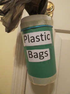 My son spent Saturday morning making a plastic bag dispenser instead of packing.